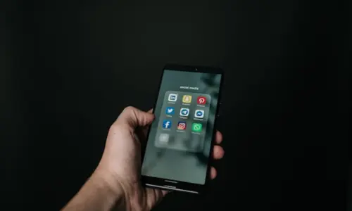 Best Freelance Digital Marketer In Kochi Managing Social Media Platforms On Smartphone